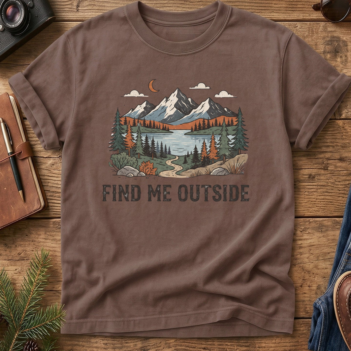 Find Me Outside Tee – moonlit mountain lake and forest trail graphic on Comfort Colors 1717 tee, flat lay