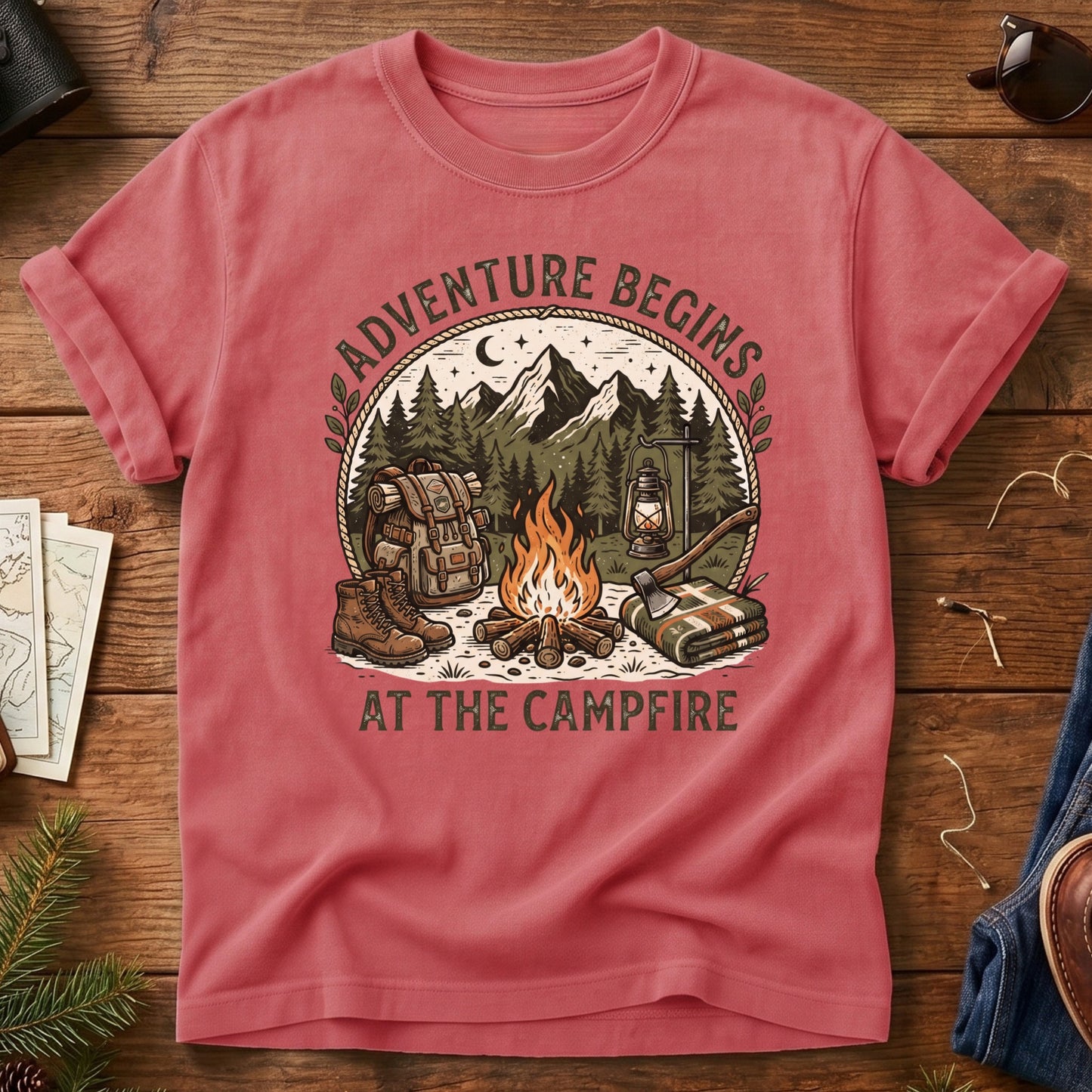 Adventure Begins Tee – styled flat lay, campfire badge graphic