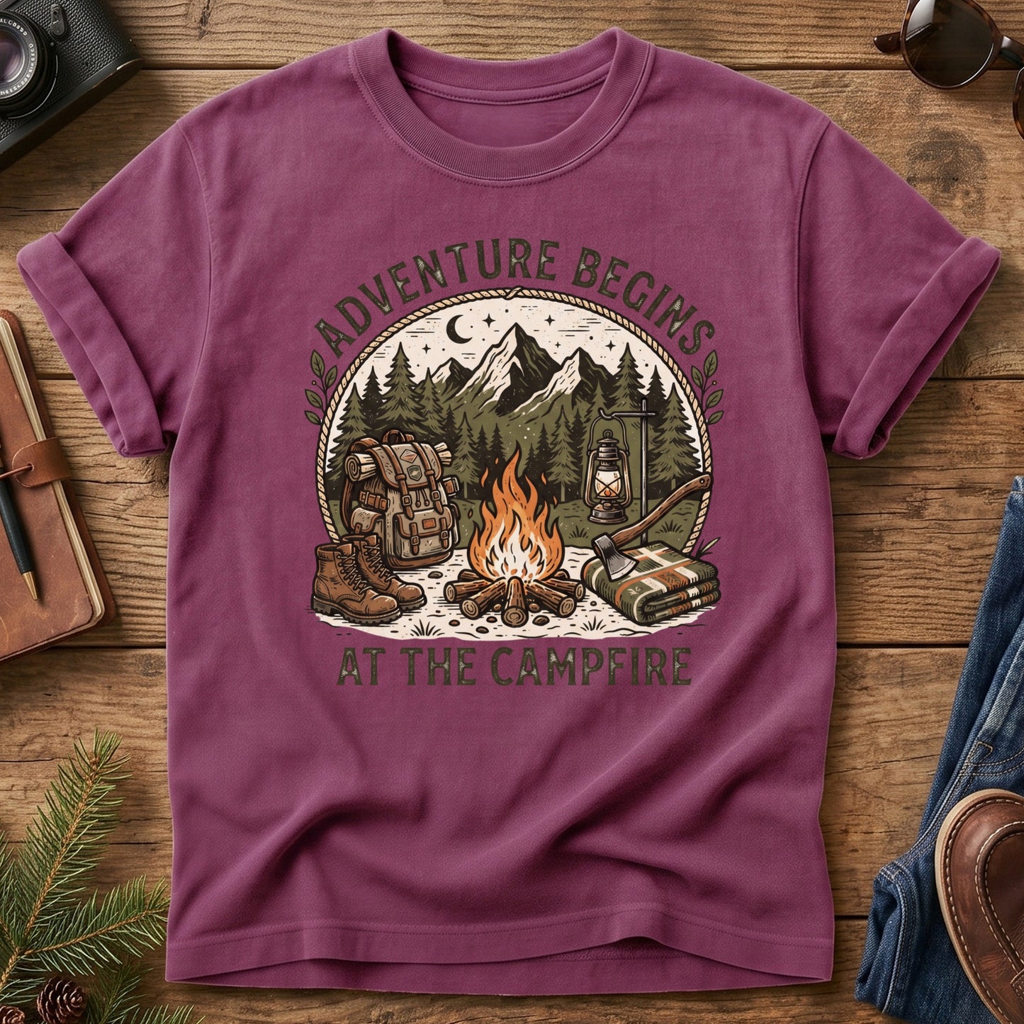 Adventure Begins Tee – Berry flat lay, campfire badge graphic
