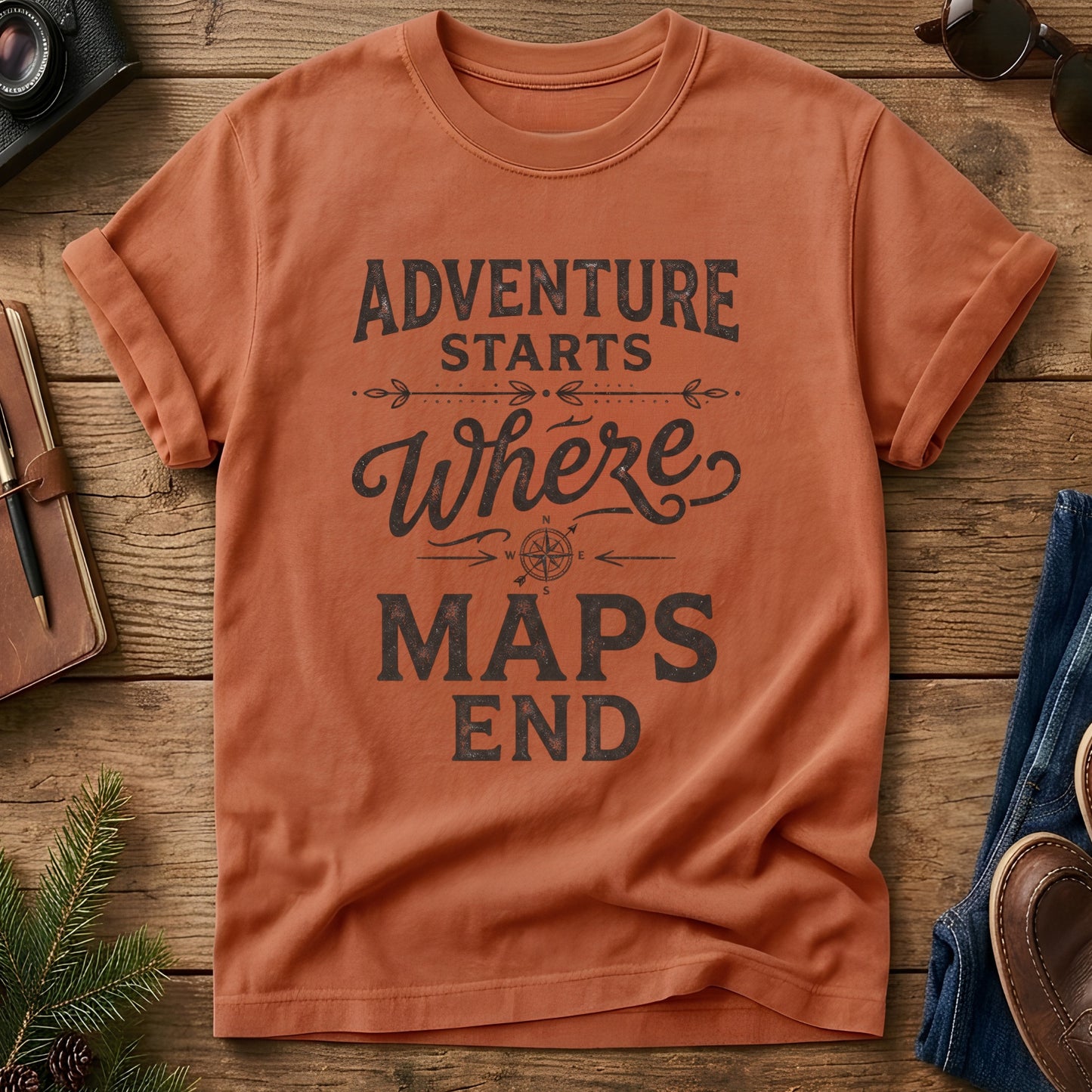 Adventure Starts Where The Maps End Tee – bold typography compass rose graphic on Comfort Colors 1717 tee, flat lay