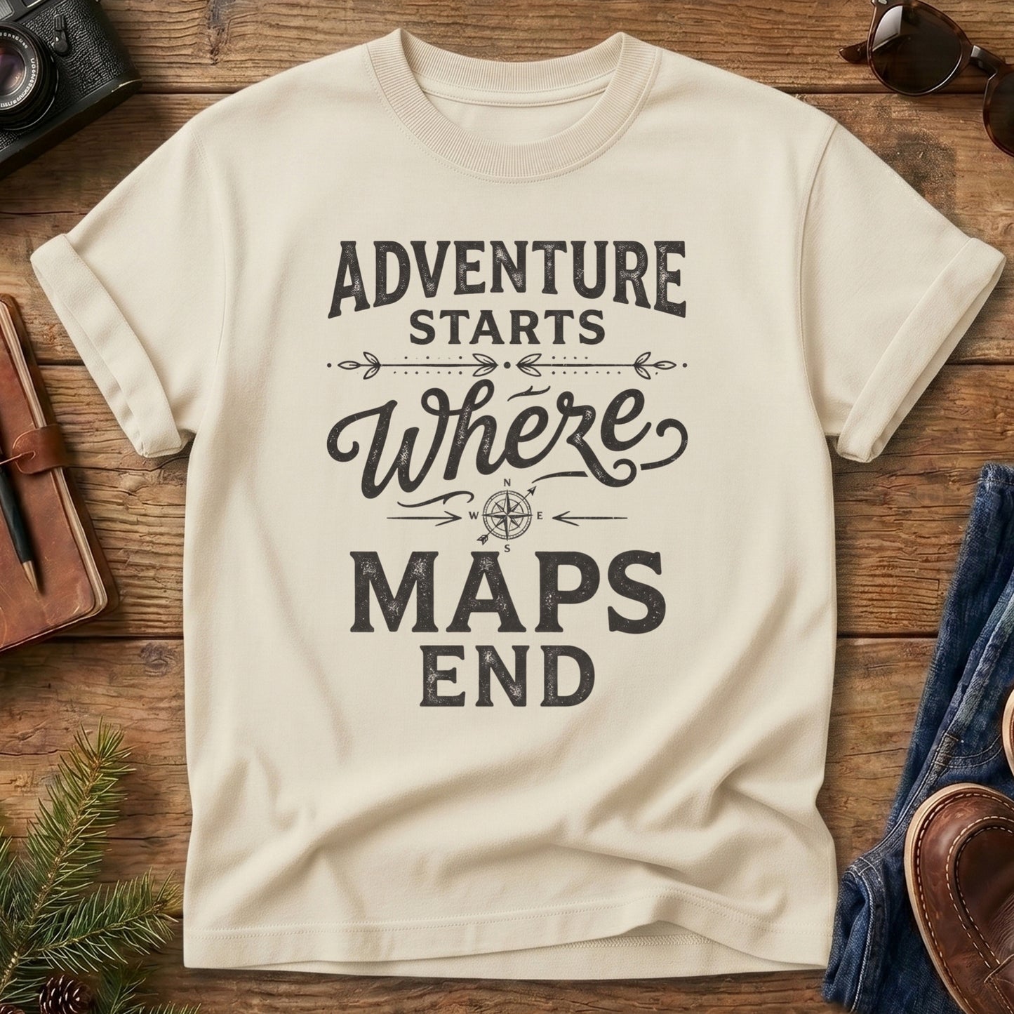 Adventure Starts Where The Maps End Tee – bold typography compass rose graphic on Comfort Colors 1717 tee, flat lay