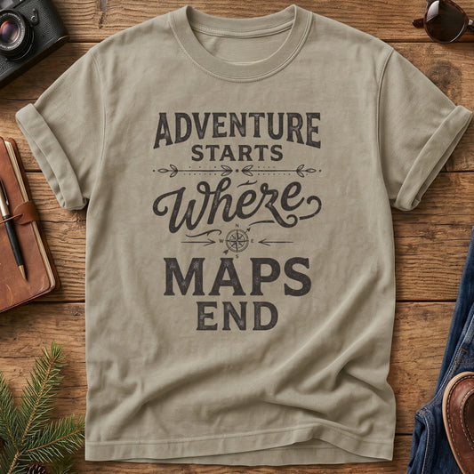 Adventure Starts Where The Maps End Tee – bold typography compass rose graphic on Comfort Colors 1717 tee, flat lay