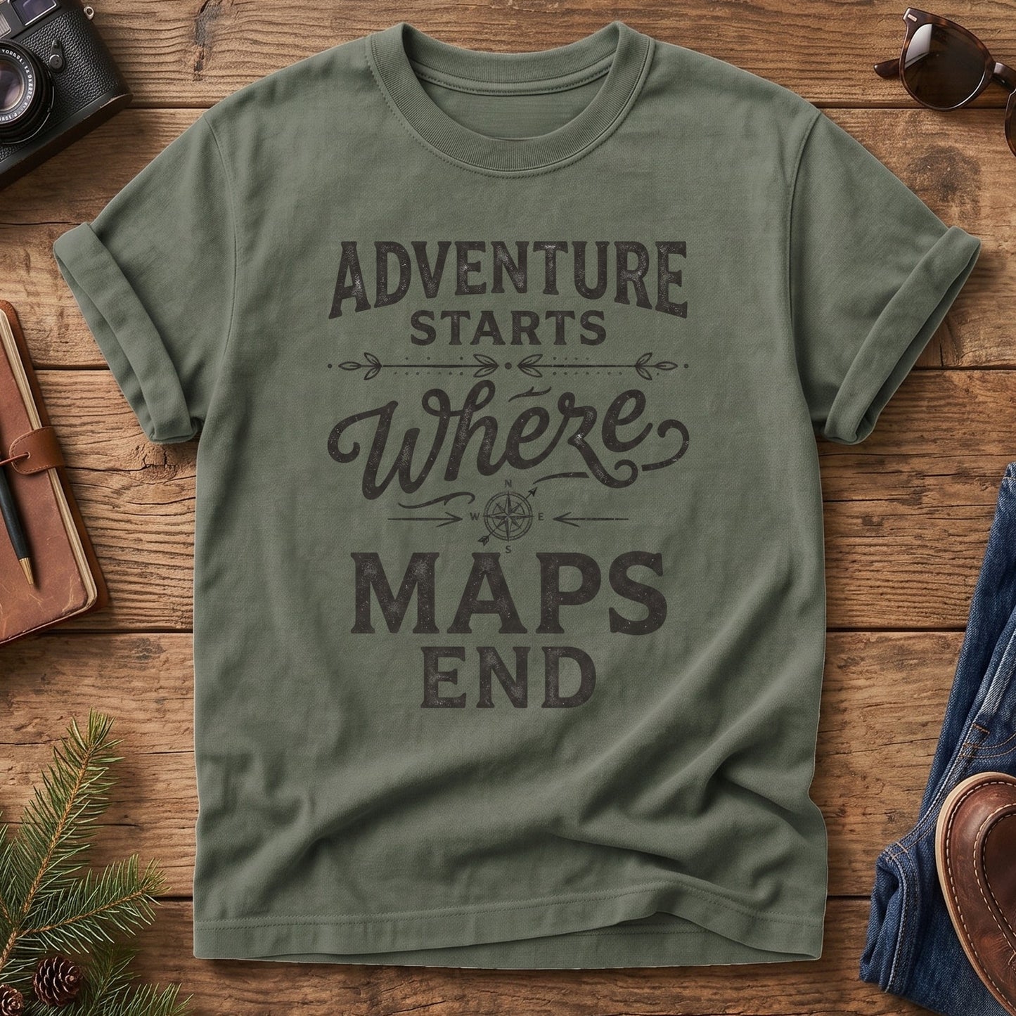 Adventure Starts Where The Maps End Tee – bold typography compass rose graphic on Comfort Colors 1717 tee, flat lay