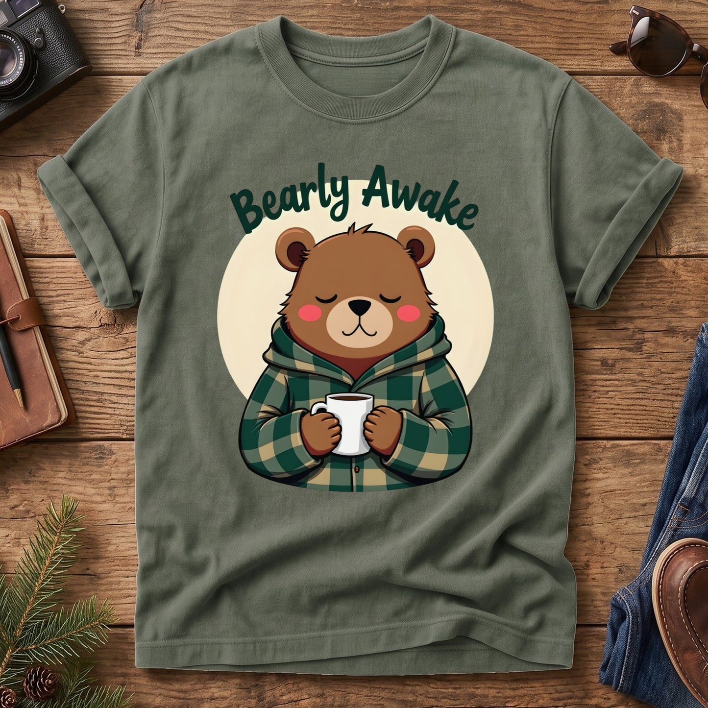 Bearly Awake Tee in Moss — cozy bear cub with coffee mug graphic