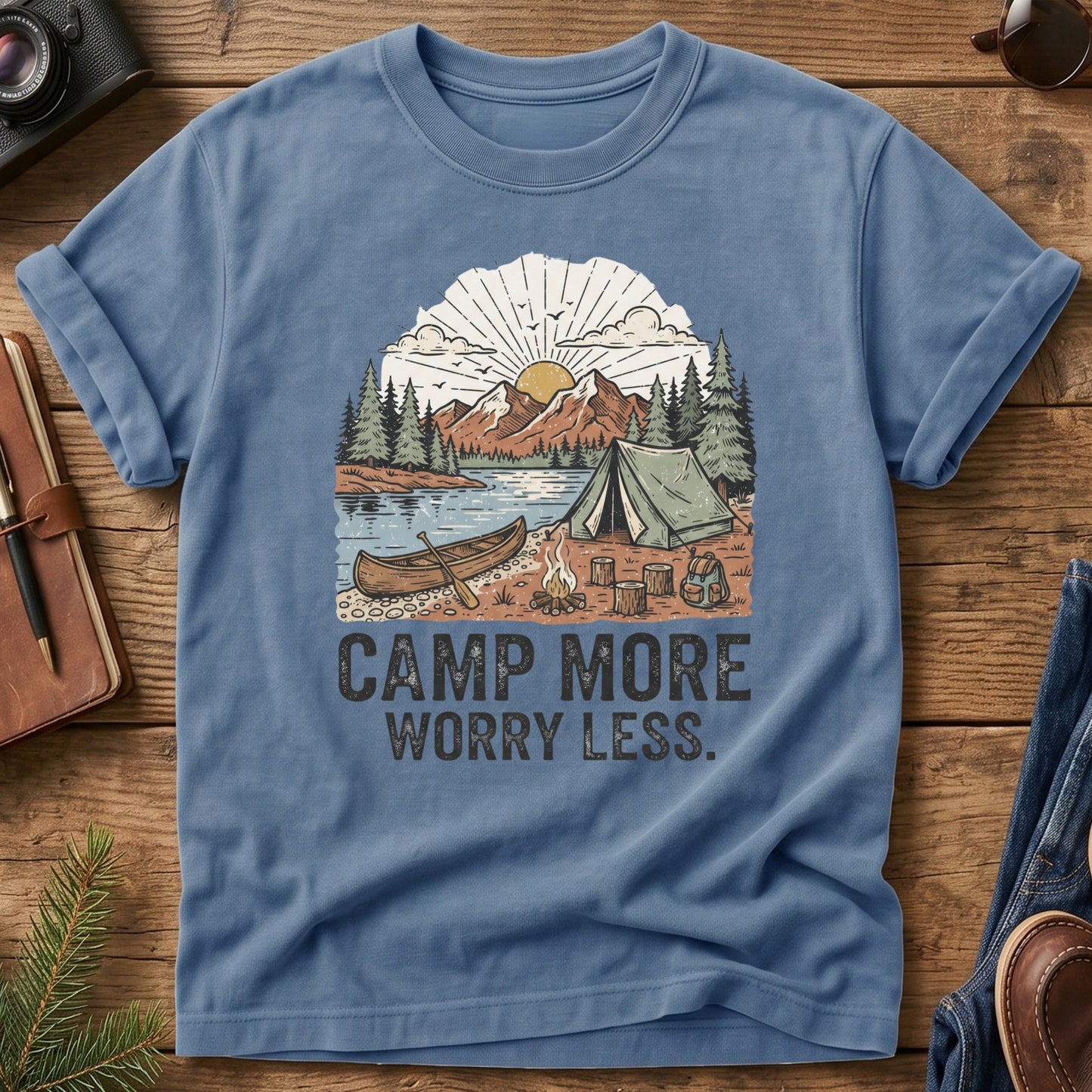 Camp More Worry Less Tee – Blue Jean flat lay, lakeside campsite graphic