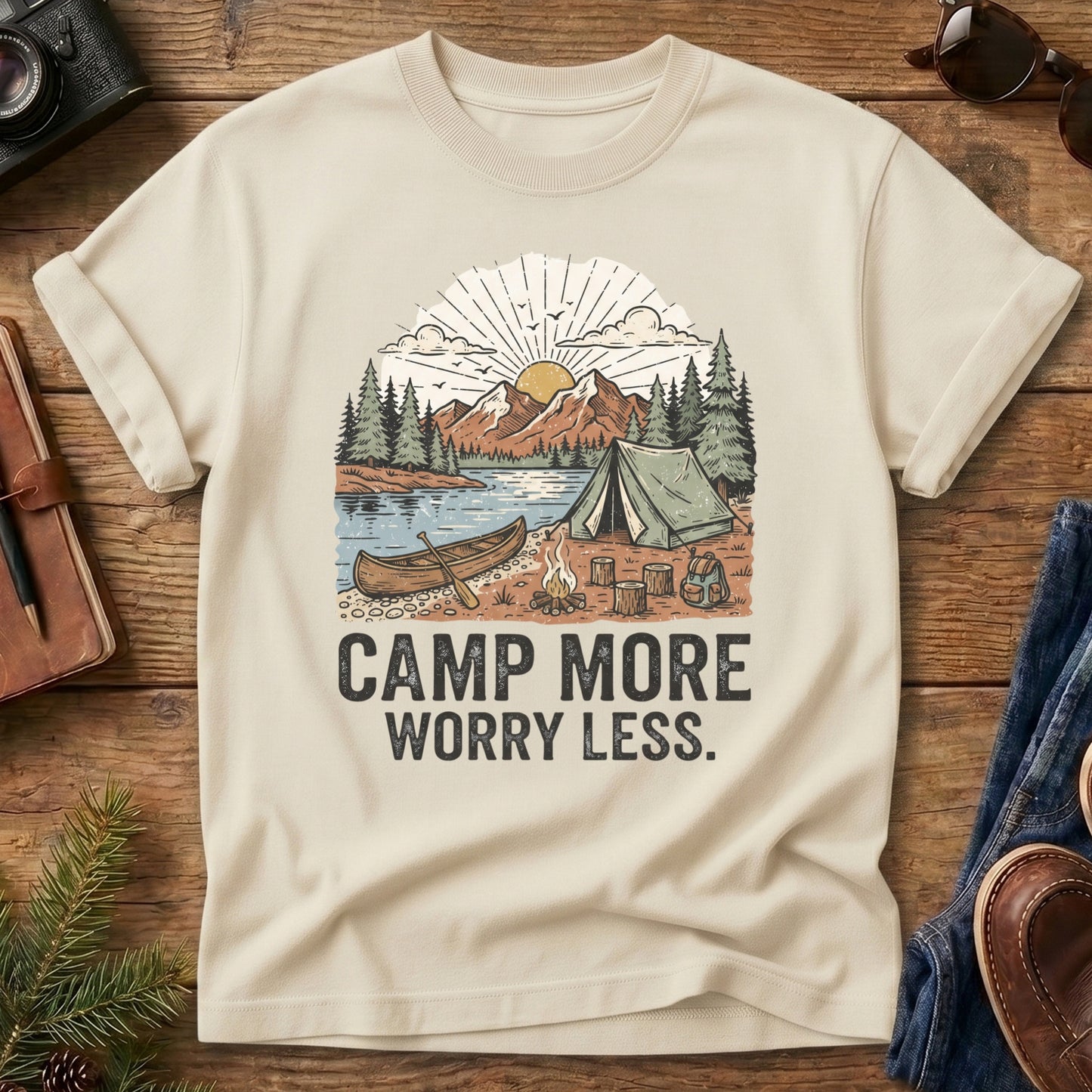 Camp More Worry Less Tee – Ivory flat lay, lakeside campsite graphic