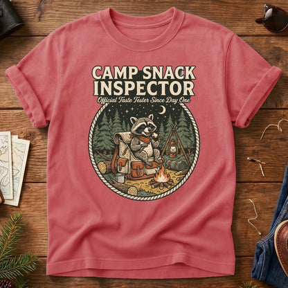 Camp Snack Inspector Tee – styled flat lay, raccoon campfire graphic