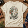 Wild at Heart Tee – Ivory flat lay, anatomical heart with wildflowers graphic