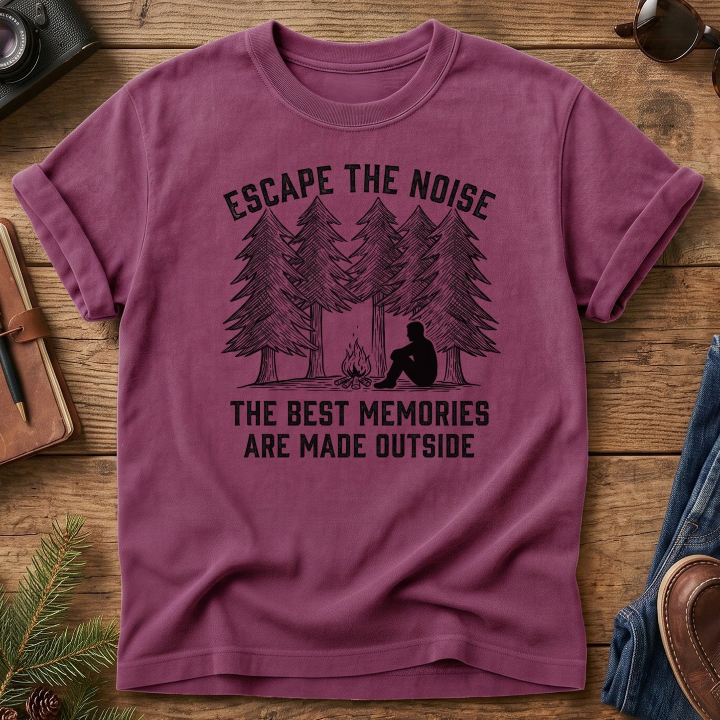 Escape The Noise Tee in Berry — campfire and pine tree graphic