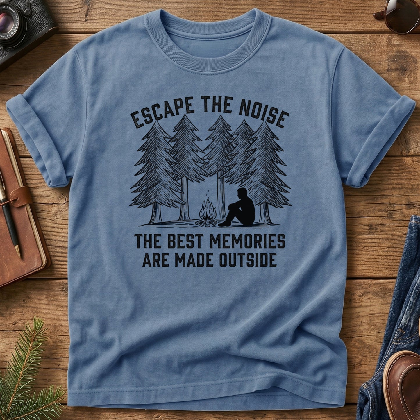 Escape The Noise Tee in Blue Jean — campfire and pine tree graphic
