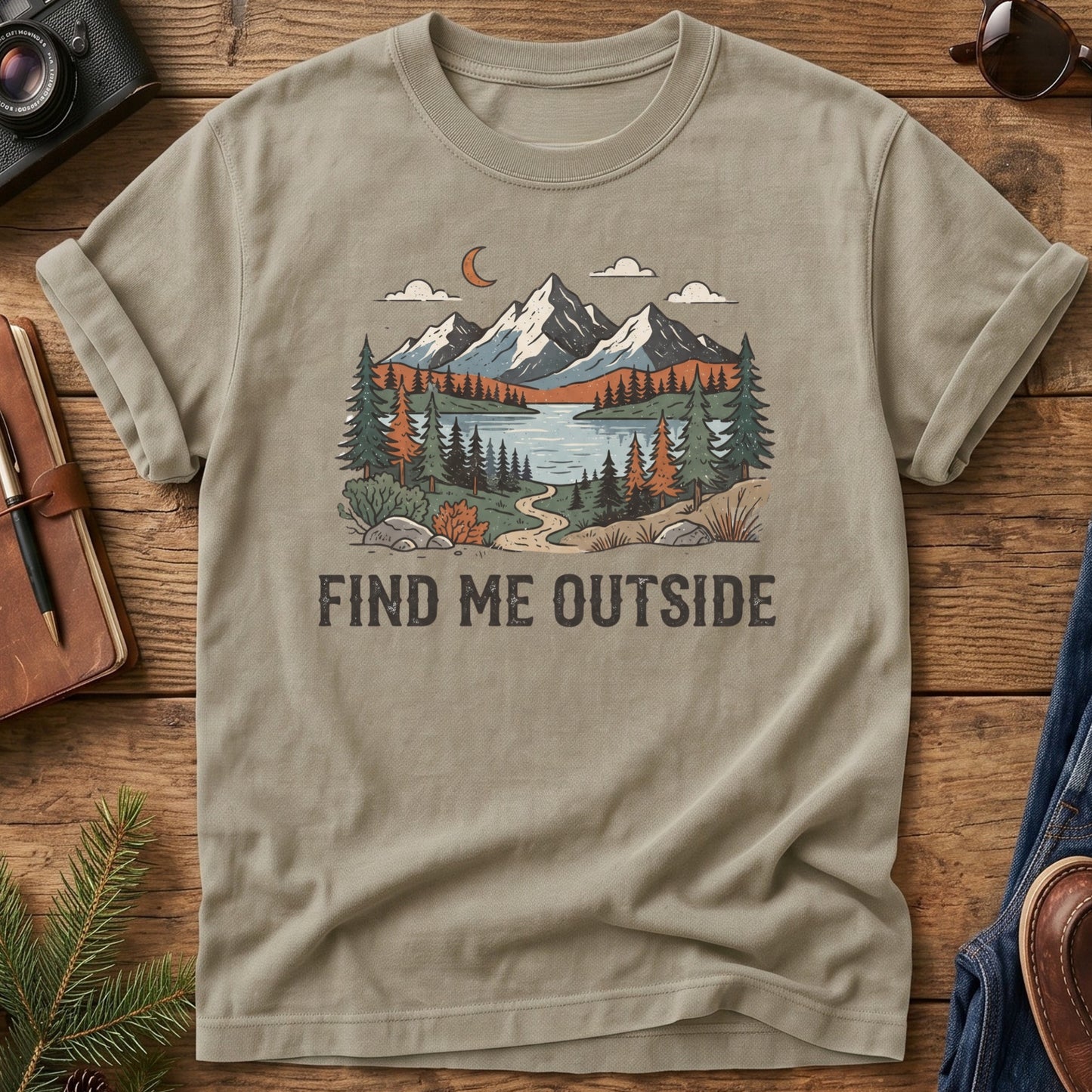 Find Me Outside Tee – moonlit mountain lake and forest trail graphic on Comfort Colors 1717 tee, flat lay