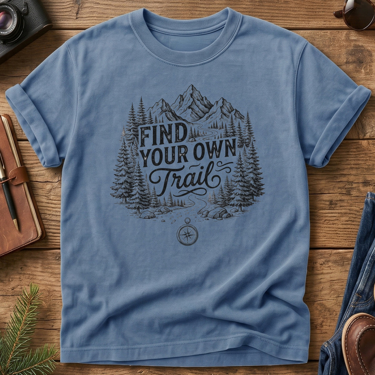 Find Your Own Trail Tee – compass and forest mountain trail graphic on Comfort Colors 1717 tee, flat lay