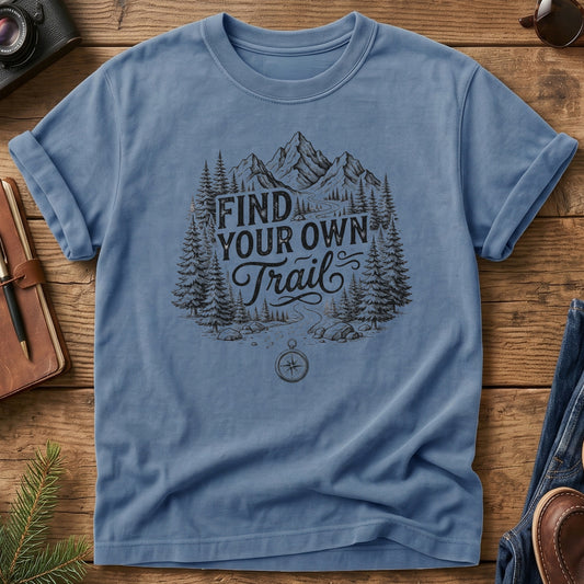 Find Your Own Trail Tee – compass and forest mountain trail graphic on Comfort Colors 1717 tee, flat lay