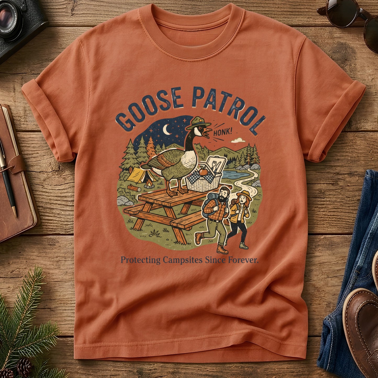 Goose Patrol Tee – styled flat lay, funny goose campsite graphic