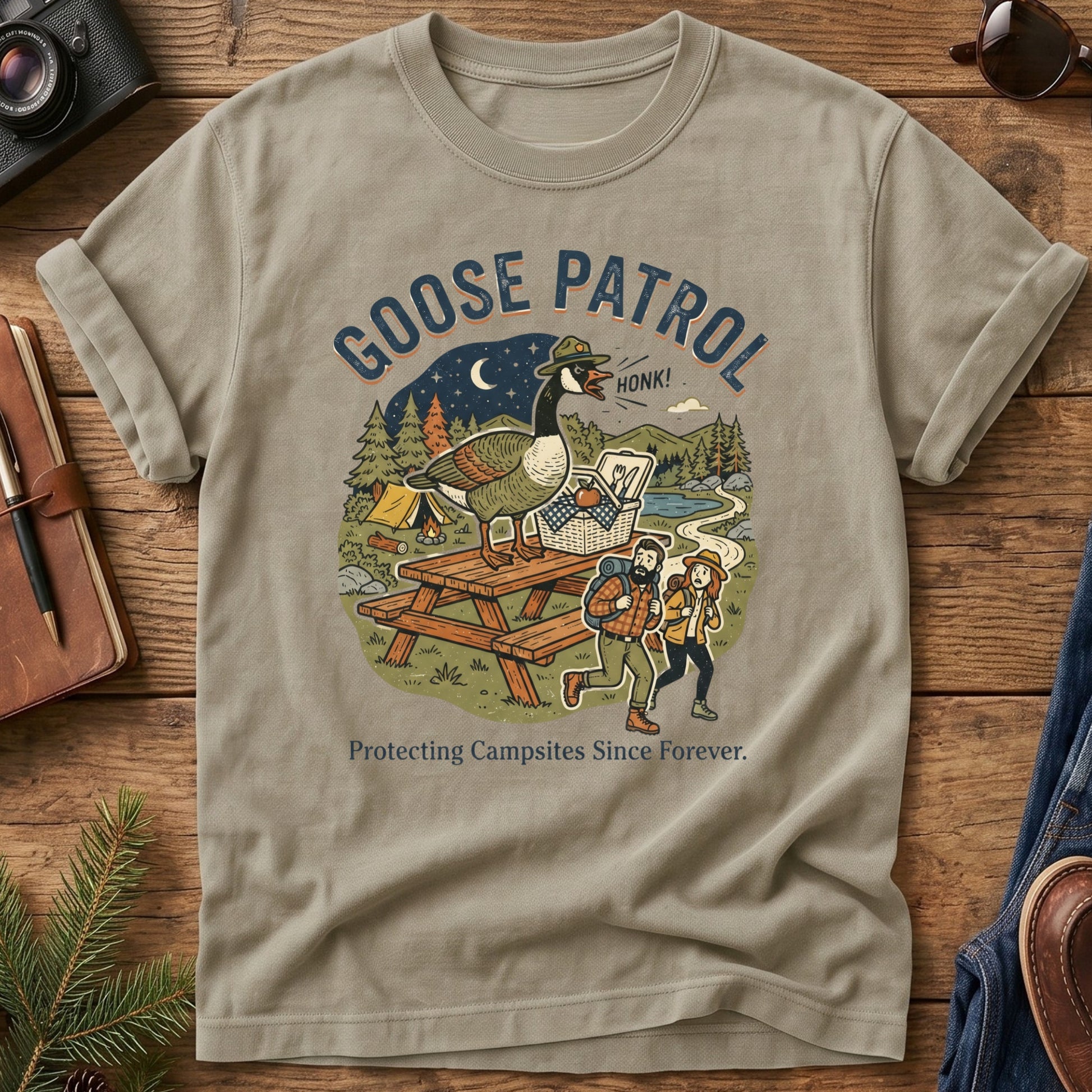 Goose Patrol Tee – Khaki flat lay, funny goose campsite graphic
