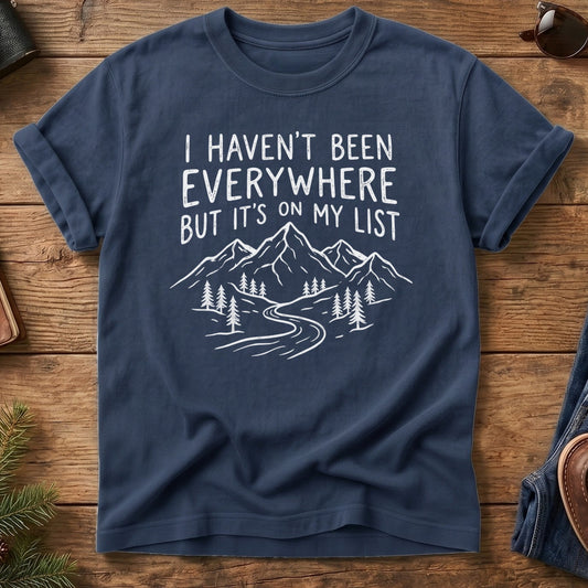 I Haven't Been Everywhere Tee in Navy — mountain and river wanderlust graphic with hand lettering