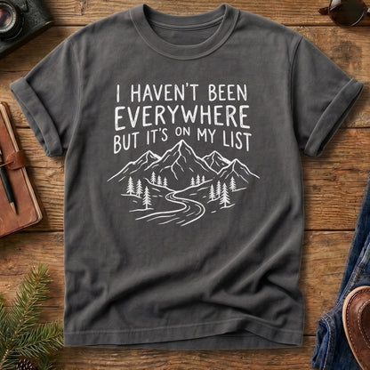 I Haven't Been Everywhere Tee in Grey — mountain and river wanderlust graphic with hand lettering