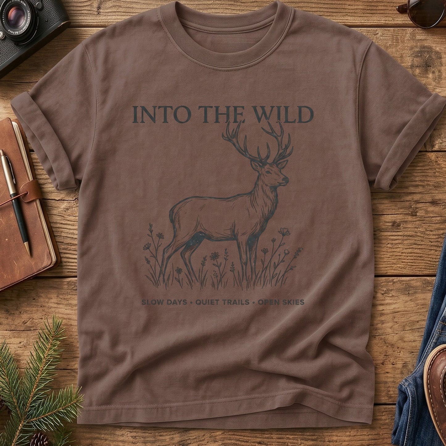 Into The Wild Tee in Espresso — fine-line stag and wildflower graphic