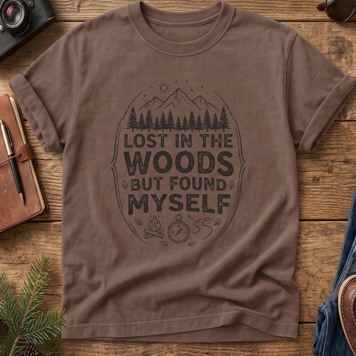 Lost In The Woods But Found Myself Tee in Espresso — camp badge graphic with compass and campfire