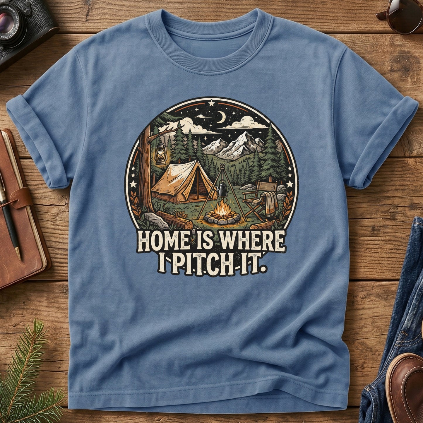 Pitch It Tee – Blue Jean flat lay, tent and campfire night sky badge graphic