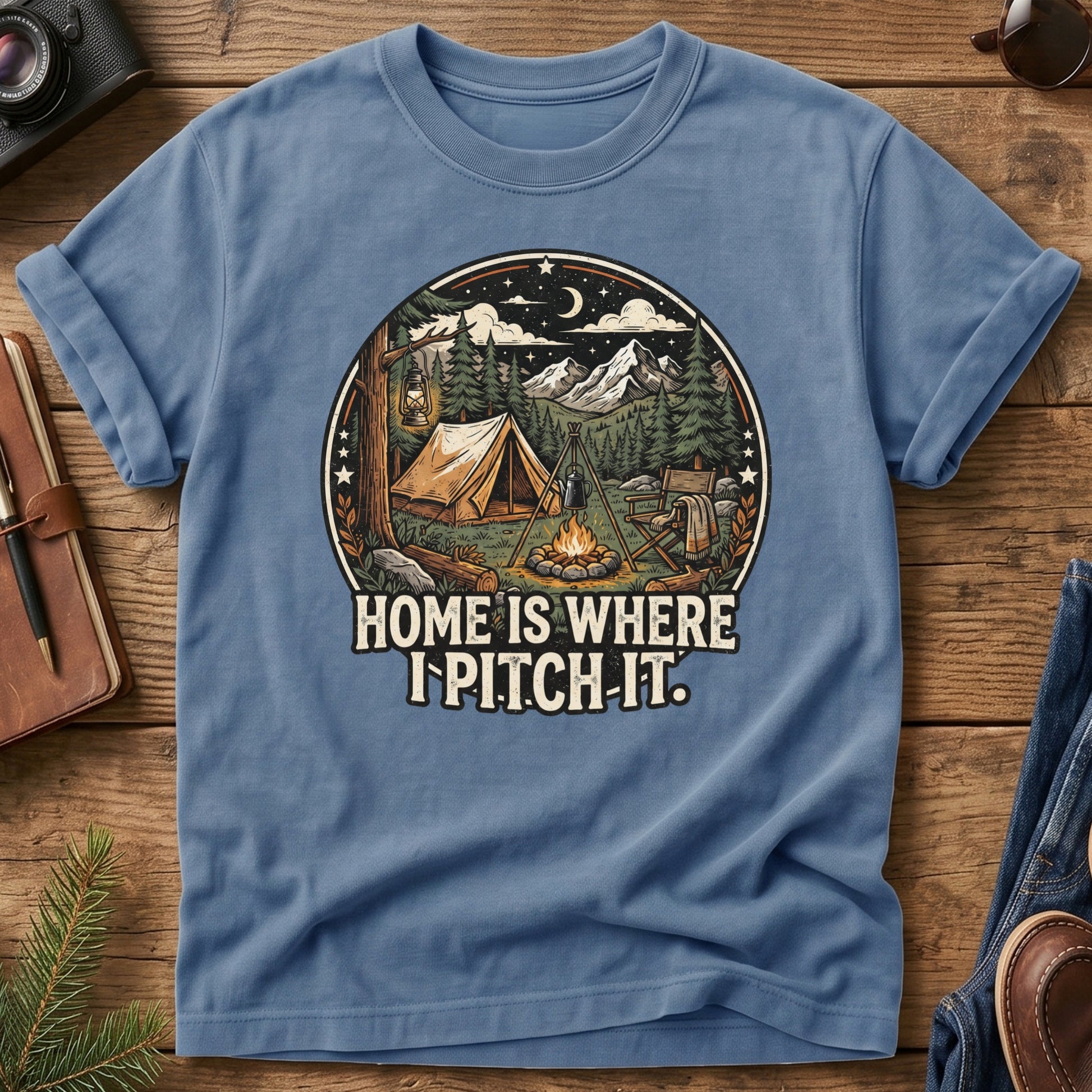Pitch It Tee – Blue Jean flat lay, tent and campfire night sky badge graphic