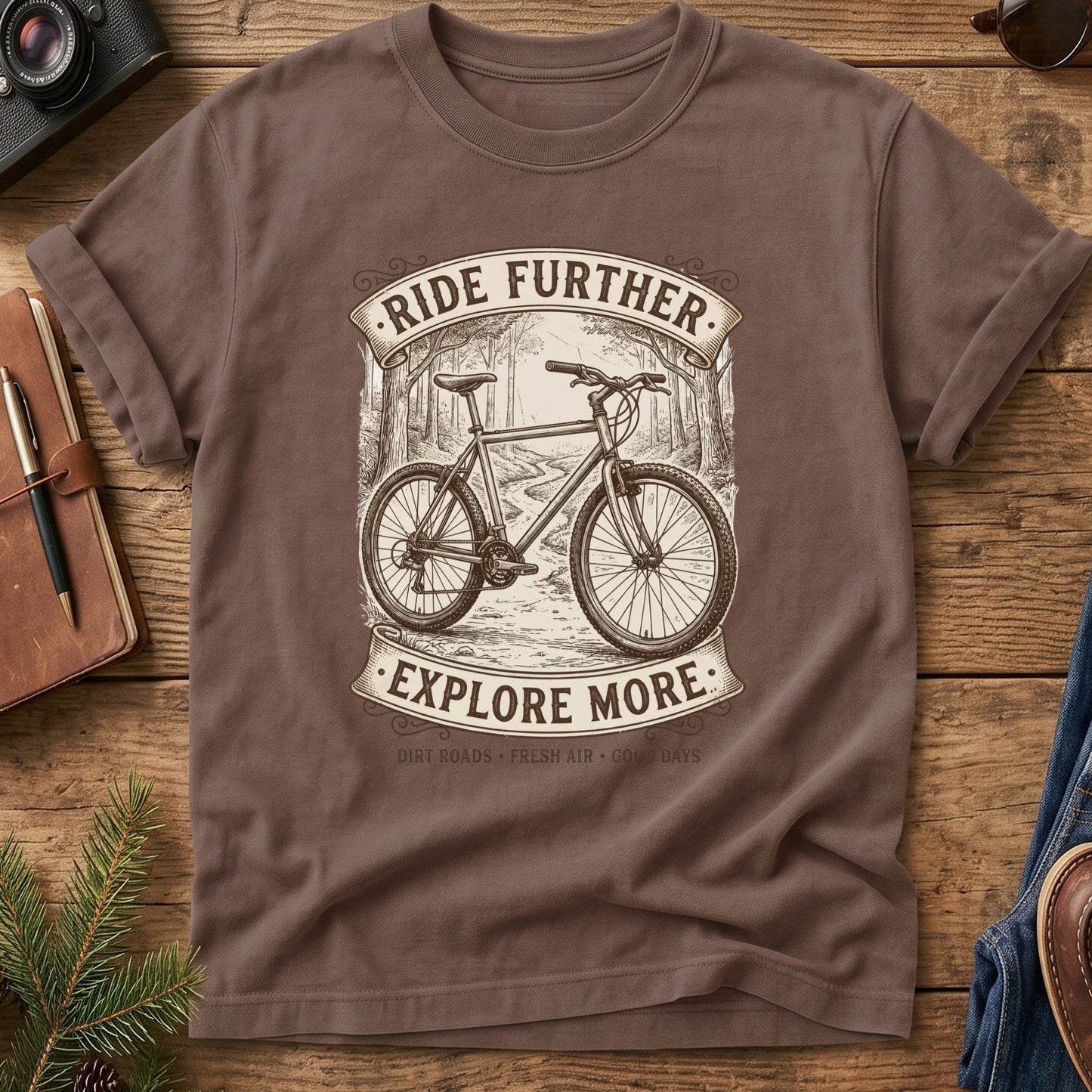 Ride Further, Explore More Tee in Espresso — vintage mountain bike badge graphic