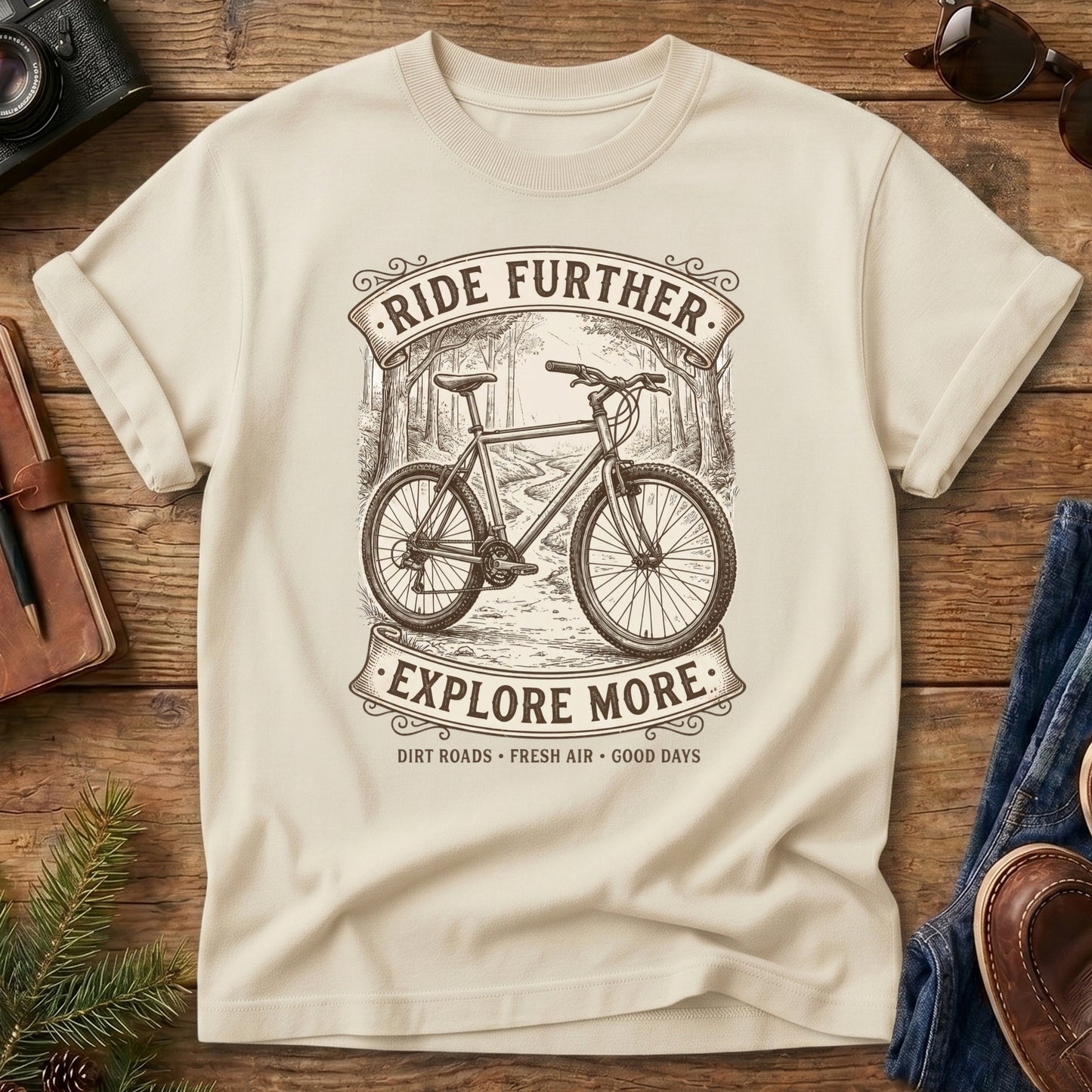 Ride Further, Explore More Tee in Ivory — vintage mountain bike badge graphic
