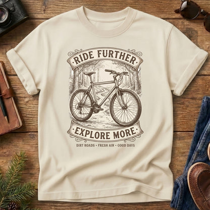 Ride Further, Explore More Tee in Ivory — vintage mountain bike badge graphic