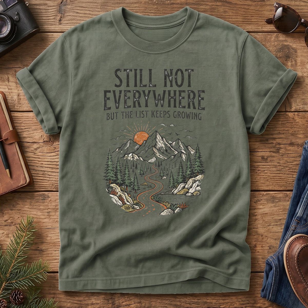 Still Not Everywhere Tee – mountain river valley sunrise graphic close-up on Comfort Colors 1717 tee