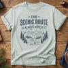 The Scenic Route Is Always Worth It Tee – hiker on winding mountain trail graphic on Comfort Colors 1717 tee, flat lay