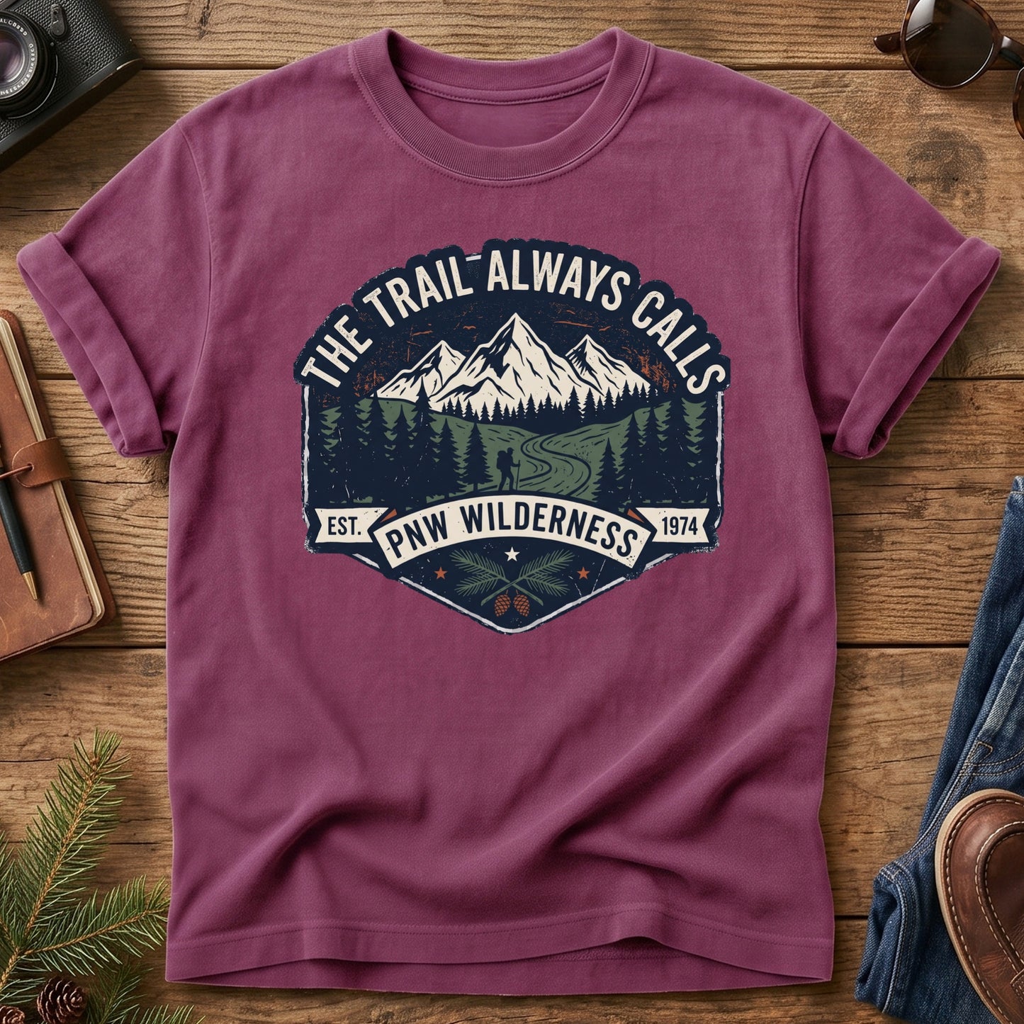 The Trail Always Calls Tee in Berry — vintage mountain badge design