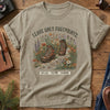 Leave No Trace Tee – Khaki flat lay, hiking boots wildflower graphic