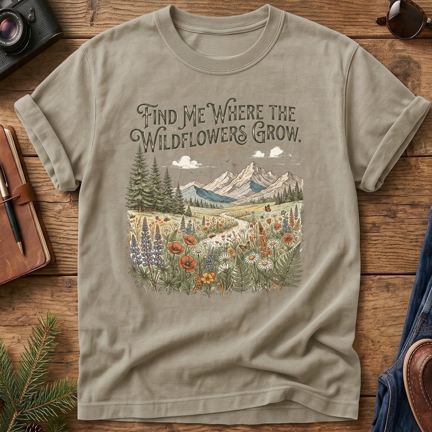 Wildflower Trail Tee – wildflower meadow trail graphic with Find Me Where the Wildflowers Grow text on Comfort Colors 1717 tee, flat lay