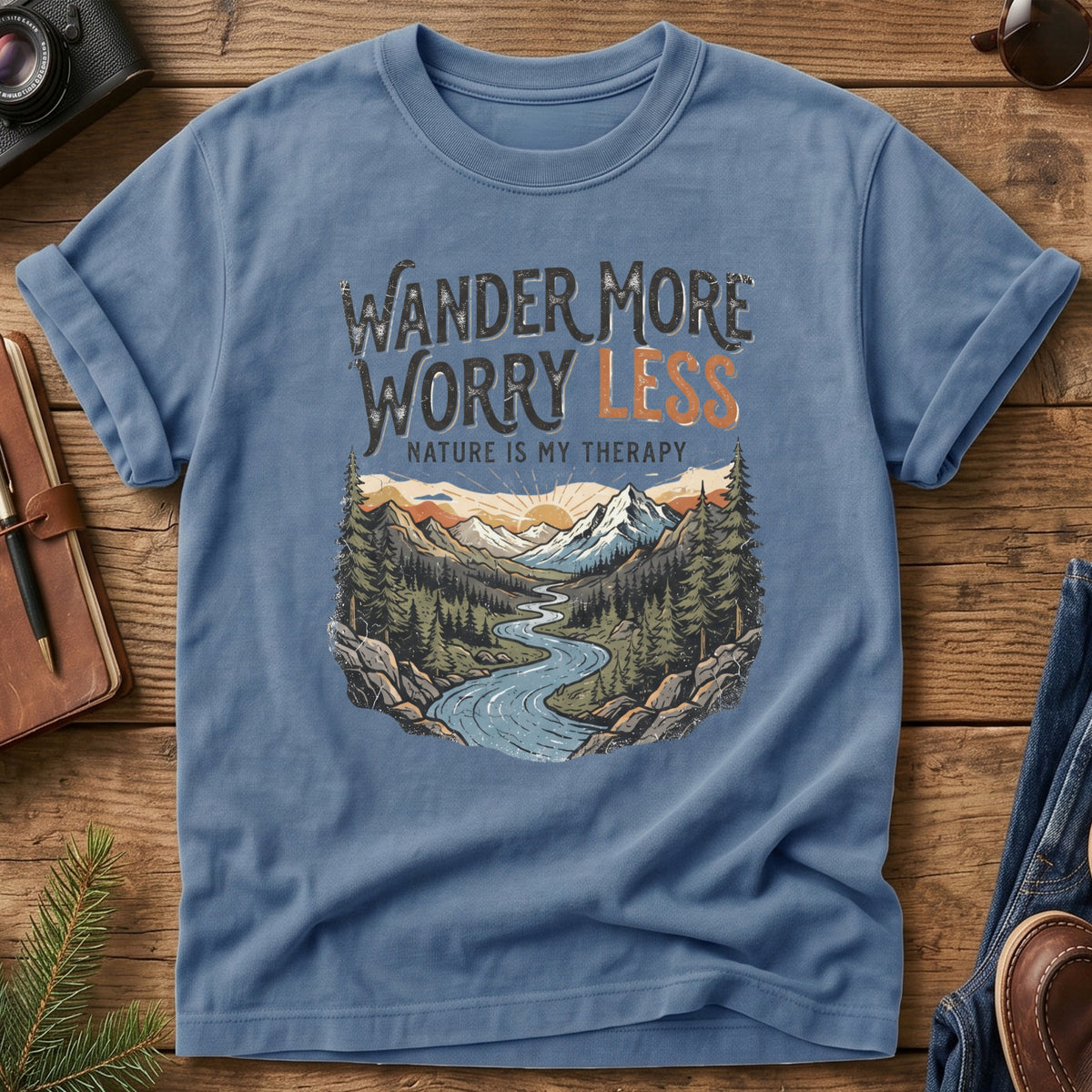 Wander More, Worry Less Tee – river through sunset mountain valley graphic on Comfort Colors 1717 tee, flat lay